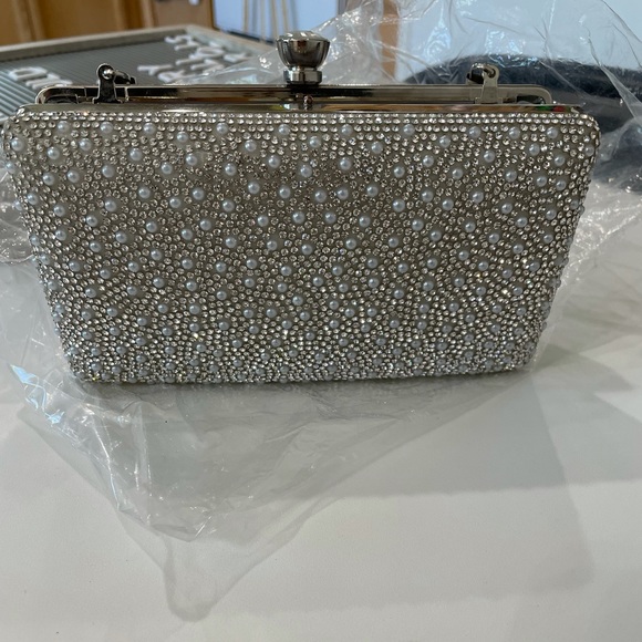 Brand new clutch/purse turns into both. No stains. - Picture 2 of 3